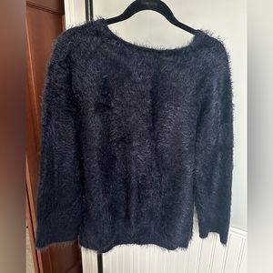 Such a soft fuzzy navy sweater. Used- good condition. Cute with everything!